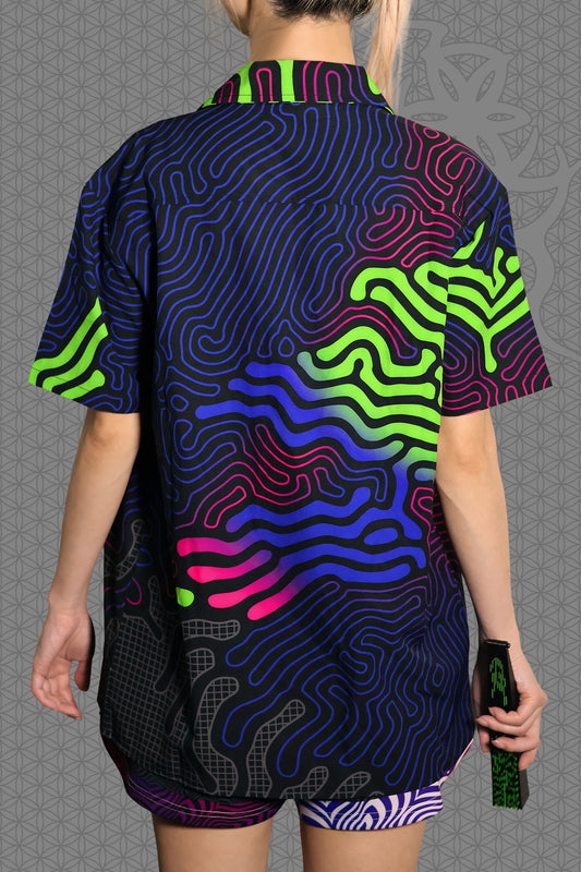 back view psychedelic short sleeve camp shirt with black base and flowing neon reaction diffusion patterns in green, pink, blue, and purple, featuring button front and spread collar