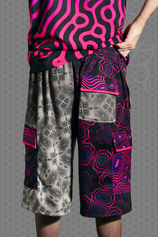 back view psychedelic cargo shorts with split design featuring grey geometric pattern on one side and vibrant pink-purple pattern on the other, with drawstring waist and side cargo pockets