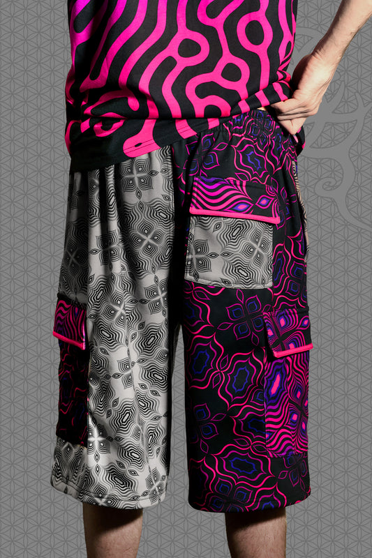 back view psychedelic cargo shorts with split design featuring grey geometric pattern on one side and vibrant pink-purple pattern on the other, with drawstring waist and side cargo pockets