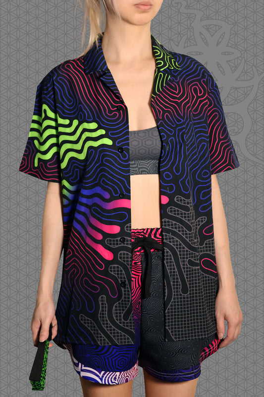 front view psychedelic short sleeve camp shirt with black base and flowing neon reaction diffusion patterns in green, pink, blue, and purple, featuring button front and spread collar