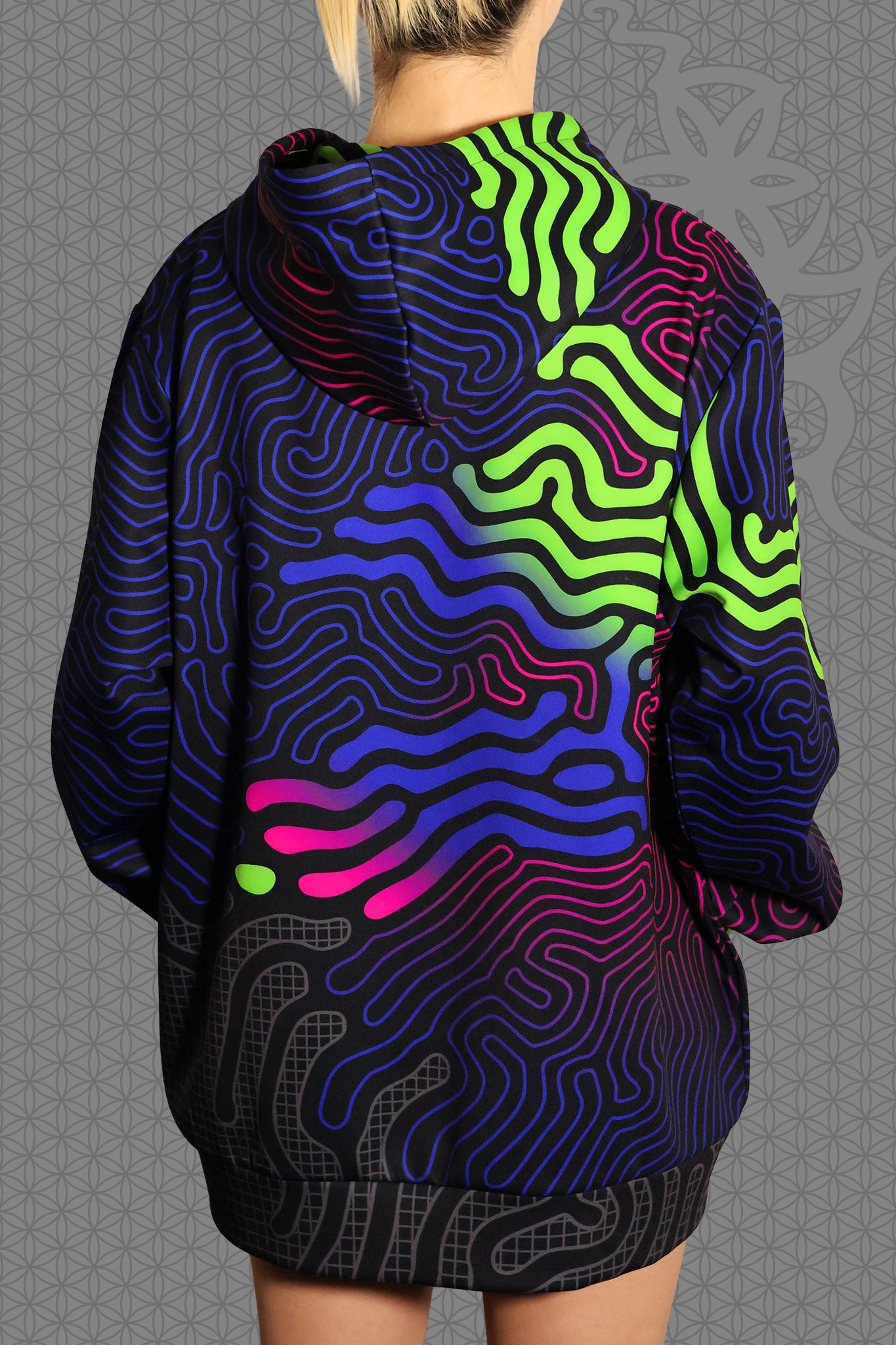 back view psychedelic rave zip hoodie with neon green, blue, and pink contour patterns on black with black fleece interior lining