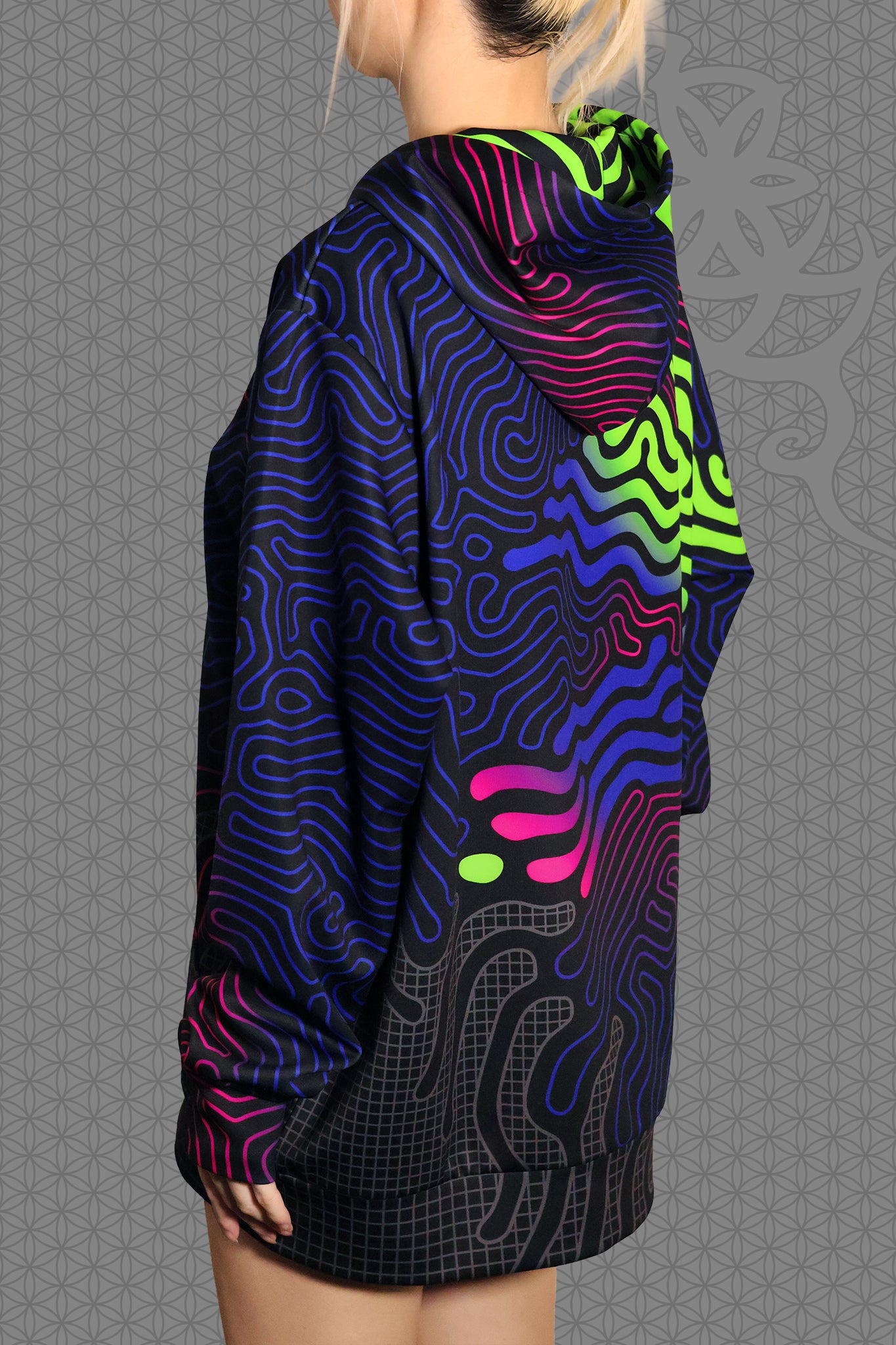 left view psychedelic rave zip hoodie with neon green, blue, and pink contour patterns on black with black fleece interior lining