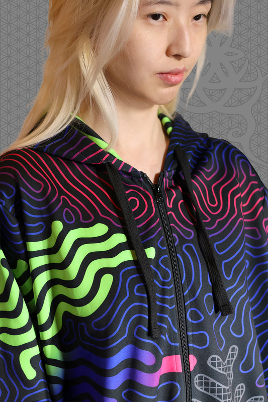 close-up view psychedelic rave zip hoodie with neon green, blue, and pink contour patterns on black with black fleece interior lining