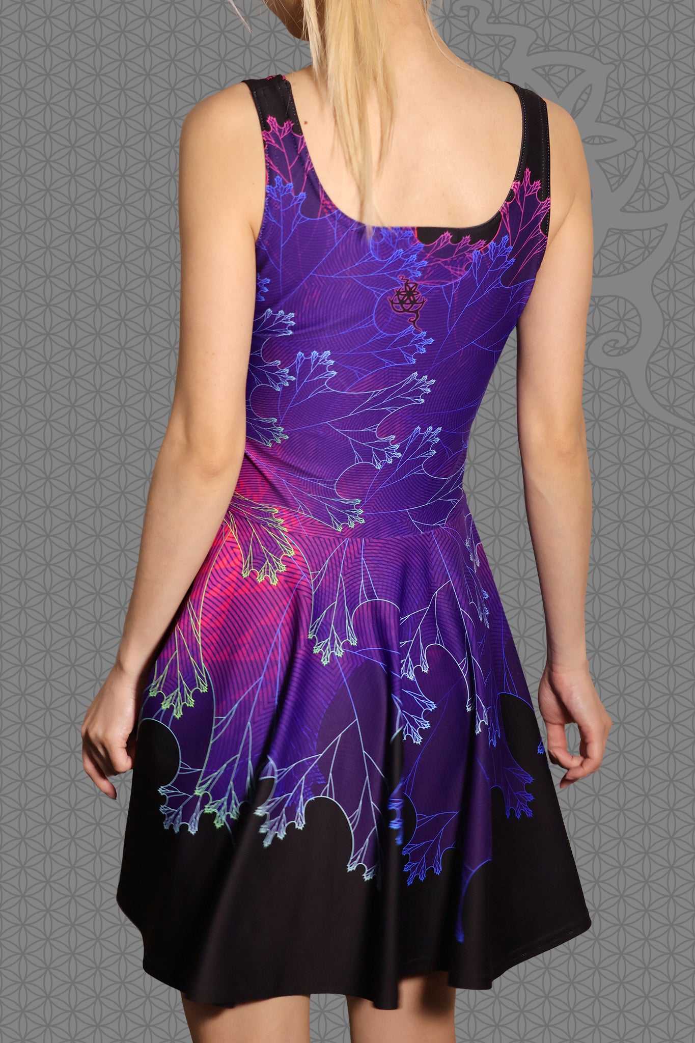 back view psychedelic rave skater dress with purple fractal botanical patterns and black gradient skirt