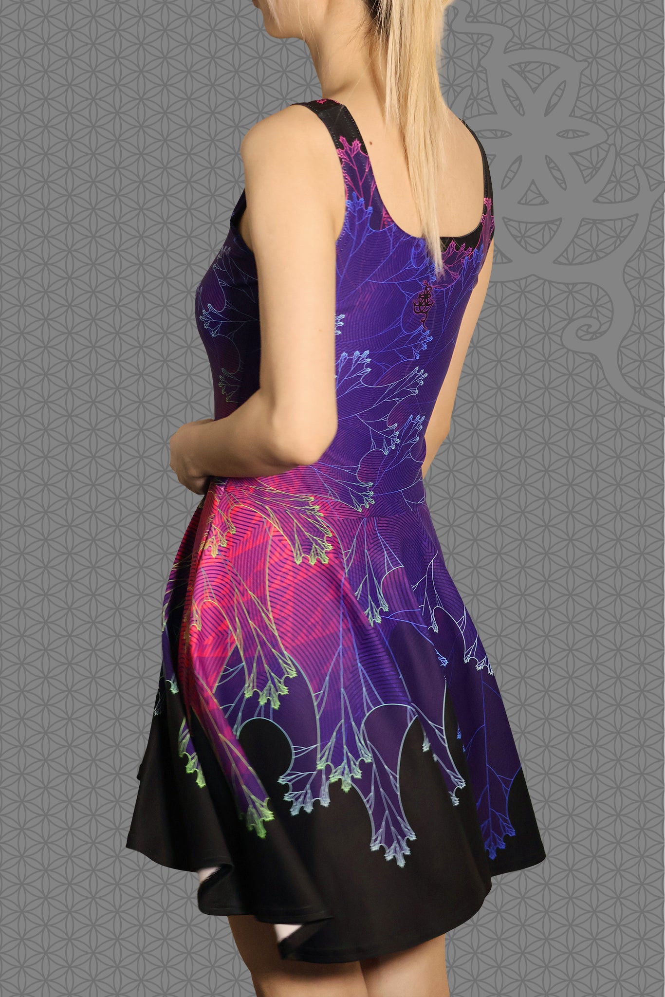 left view psychedelic rave skater dress with purple fractal botanical patterns and black gradient skirt