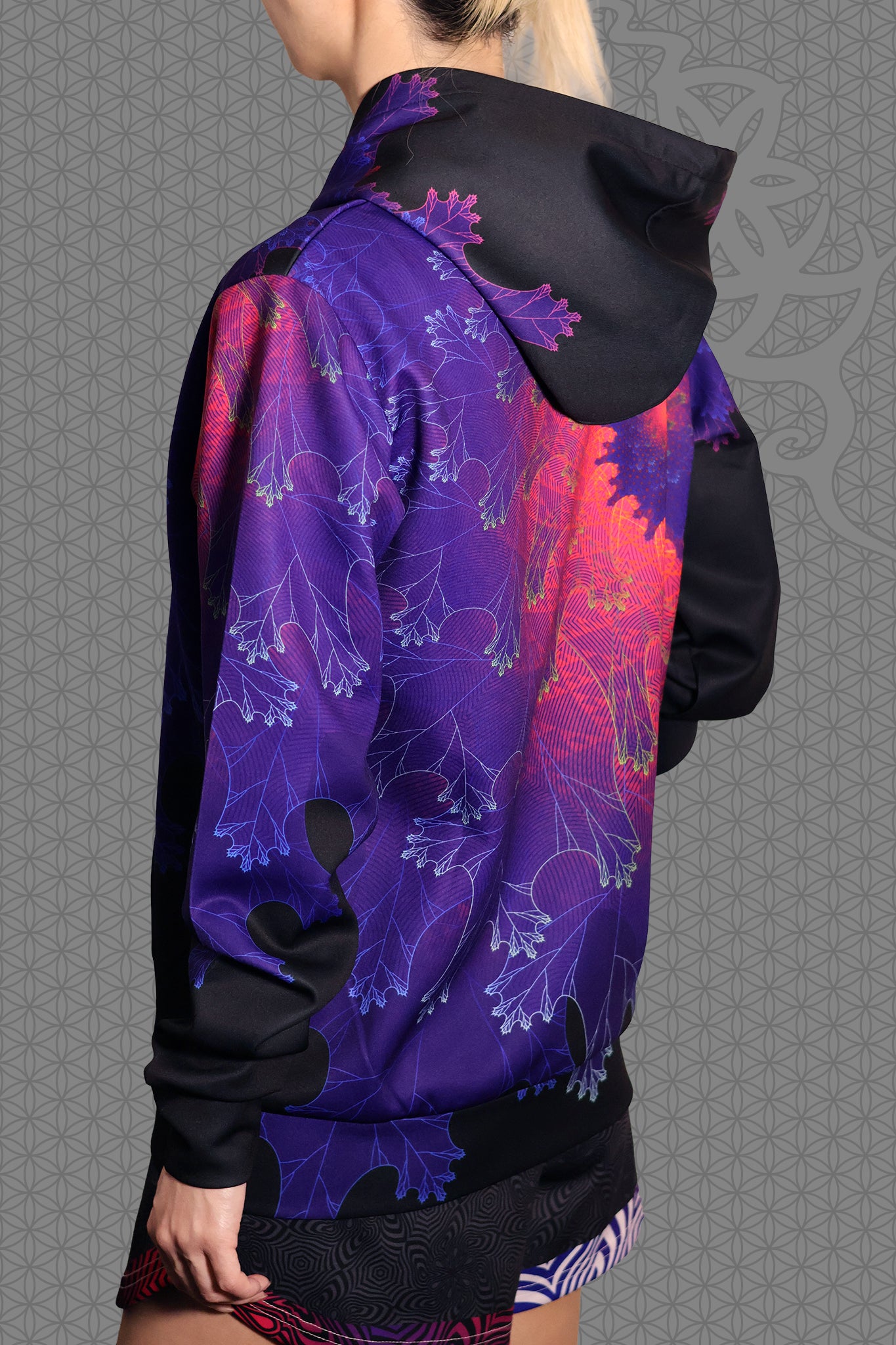 left view psychedelic rave zip hoodie with purple fractal spiral pattern on black with black fleece lining