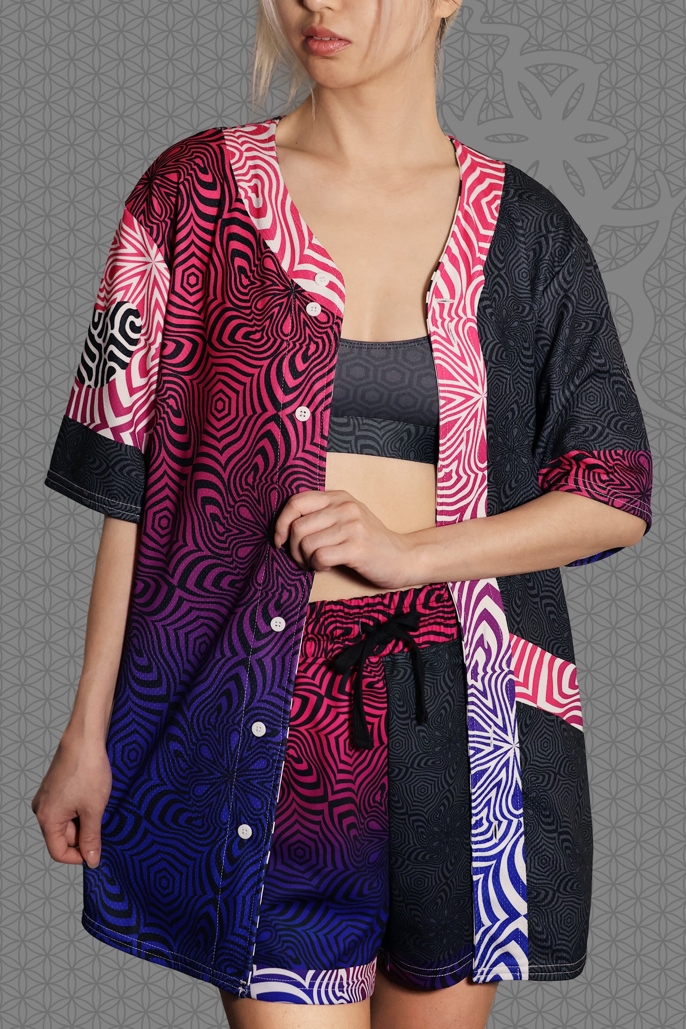 front view unbuttoned psychedelic rave baseball jersey with neon pink, purple, and blue geometric optical patterns and gradient panels