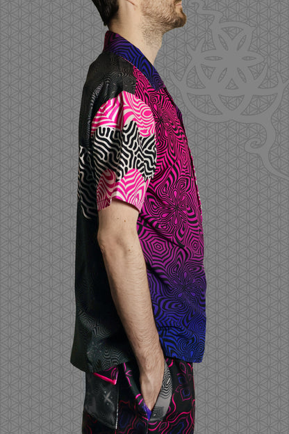 right view psychedelic rave camp shirt with neon pink, purple, and blue geometric optical patterns and gradient panels