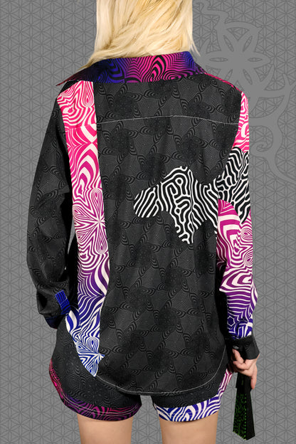 back view psychedelic rave women button up shirt with neon pink, purple, and blue geometric optical patterns and gradient panels