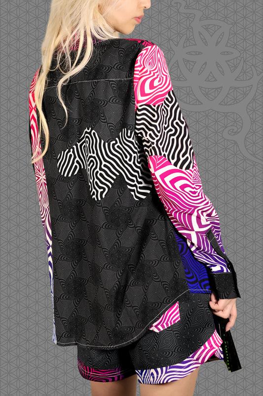 right view psychedelic rave women button up shirt with neon pink, purple, and blue geometric optical patterns and gradient panels