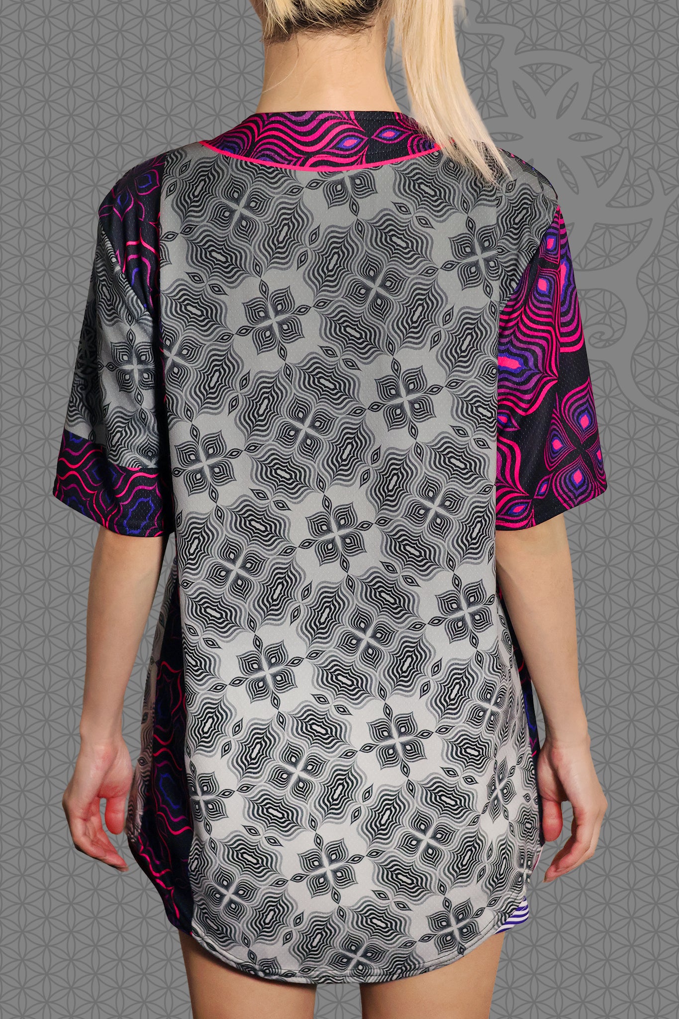 back view psychedelic rave baseball jersey with black and neon pink geometric optical patterns and contrasting gray psychedelic pattern panels
