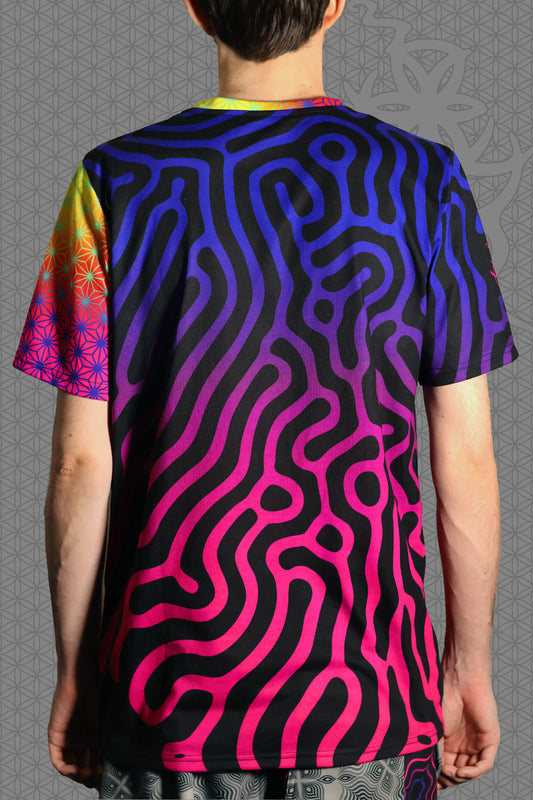 back view psychedelic short sleeve t-shirt with black base and flowing pink-to-purple gradient pattern, featuring contrasting rainbow geometric trim on the sleeve and collar