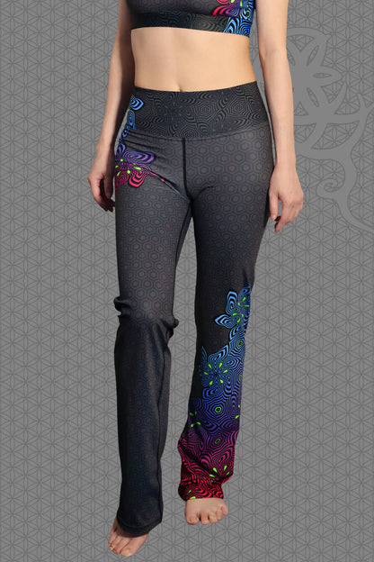 front view psychedelic rave flare leggings with neon pink, purple, blue, and green flower patterns on black